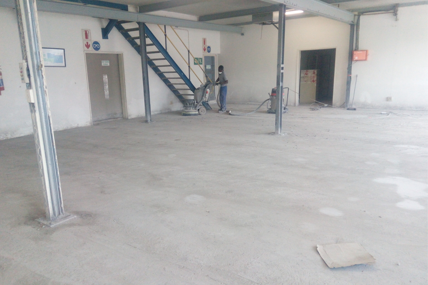 Factory floor ground to clean concrete.